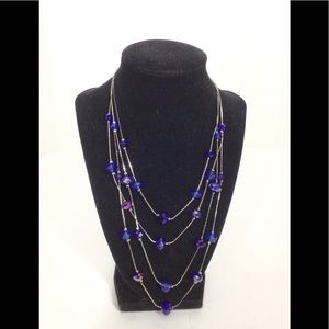 Women’s cobalt blue silver tone 4 strand necklace extended chain.
